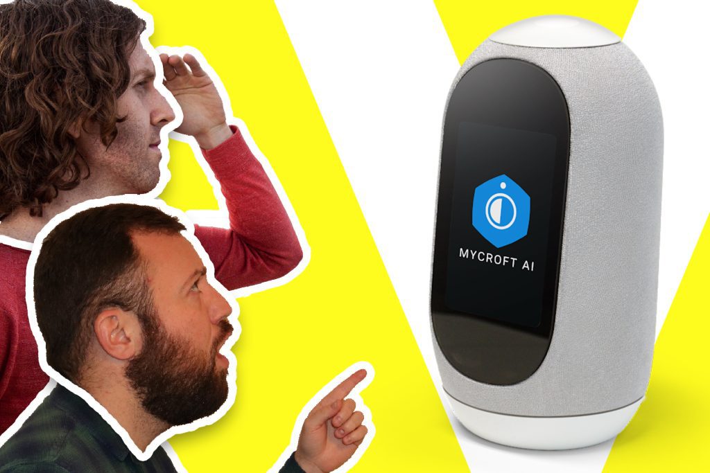 Kane Simms and Dustin Coates looking toward a Mycroft Mark II smart speaker